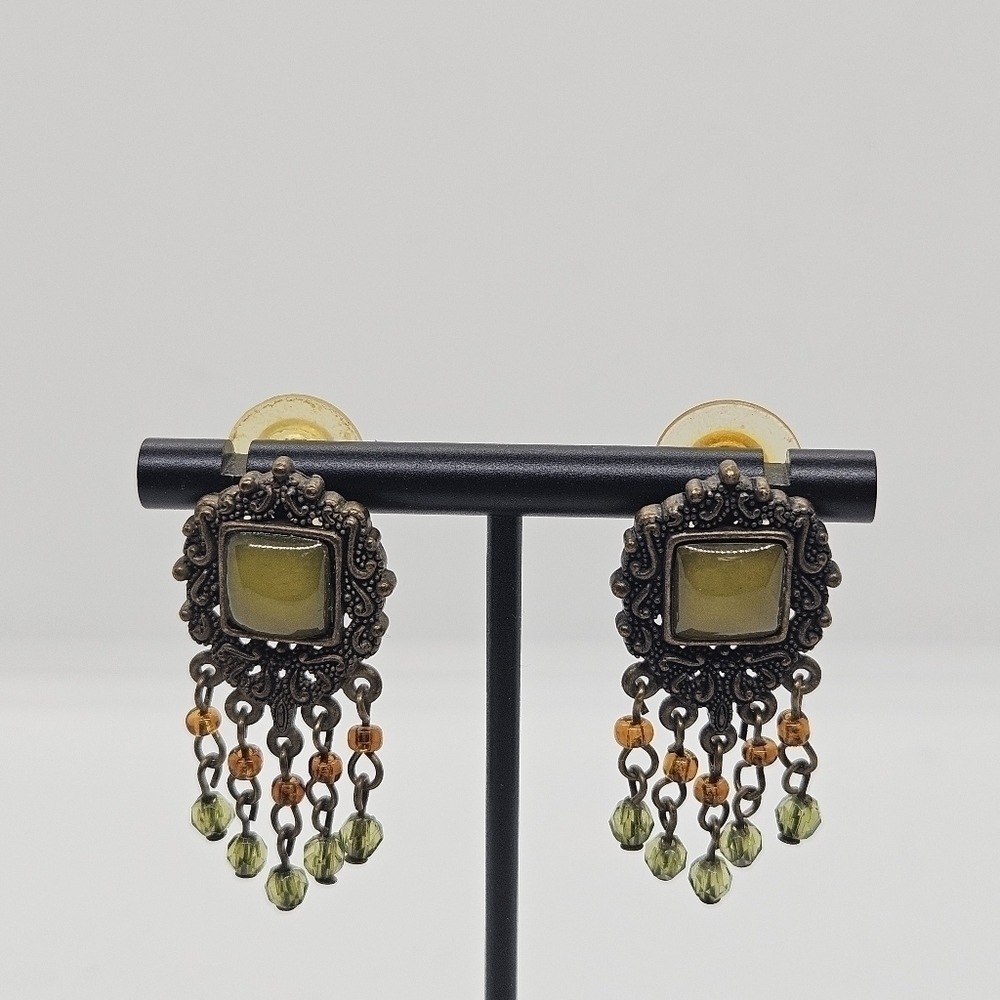 bronze colored earrings with green and orange beading